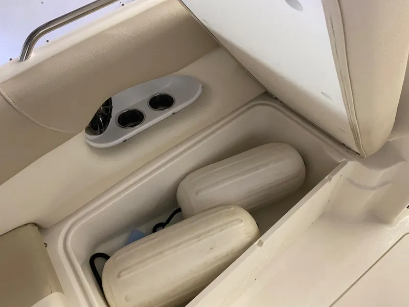 Slide: The Image of Storage compartment on a 2018 NauticStar 243DC Sport Deck boat with cup holders. - 17