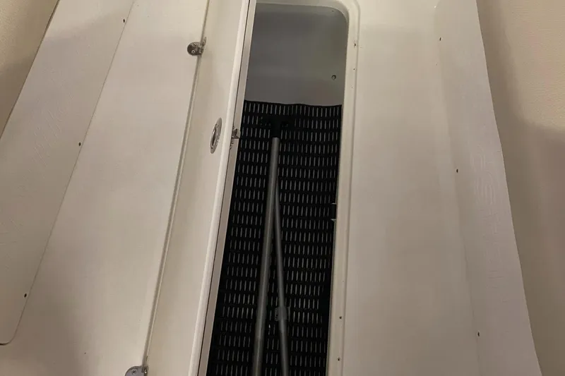 Slide: The Image of 2018 NauticStar 243DC Sport Deck storage compartment - 19