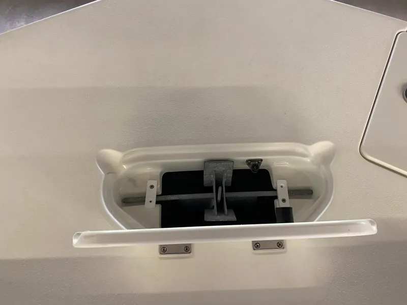 Slide: The Image of 2018 NauticStar 243DC Sport Deck anchor storage compartment. - 20