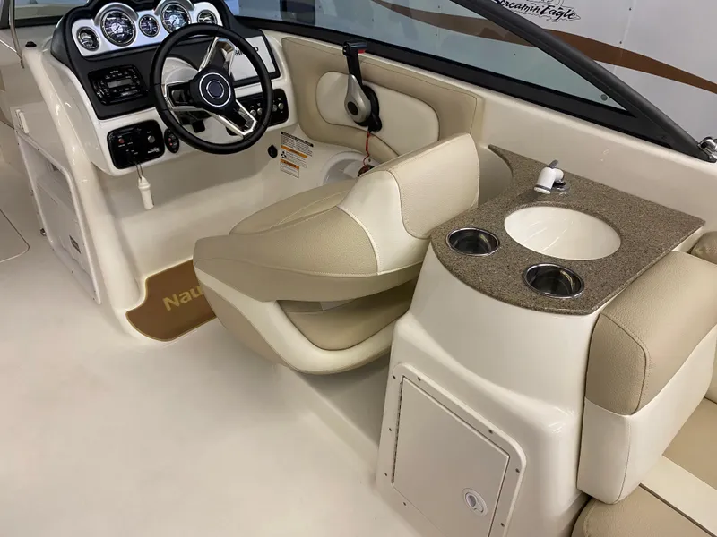 Slide: The Image of 2018 NauticStar 243DC Sport Deck boat interior with helm and seating. - 8