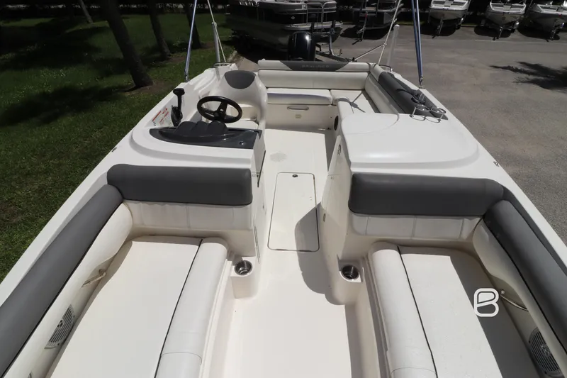 Slide: The Image of 2018 Bayliner 210 DB boat interior with spacious seating and modern design. - 12