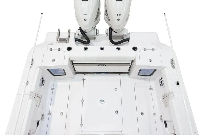 Slide: The Image of 2024 Sportsman 322 OPEN CC INCOMING boat deck with dual engines. - 12