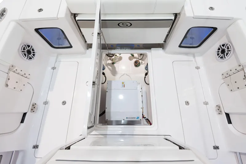 Slide: The Image of 2024 Sportsman 322 OPEN CC INCOMING boat interior with open hatch. - 15