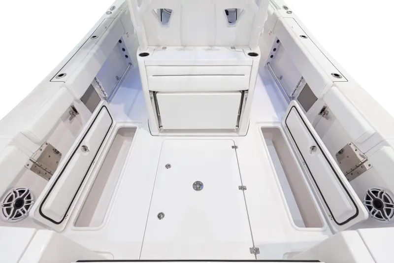 Slide: The Image of 2024 Sportsman 322 OPEN CC INCOMING boat interior with ample storage and seating. - 16