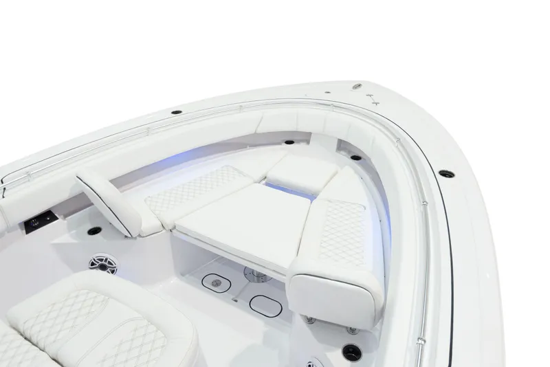 Slide: The Image of 2024 Sportsman 322 OPEN CC boat interior with white cushioned seating. - 18