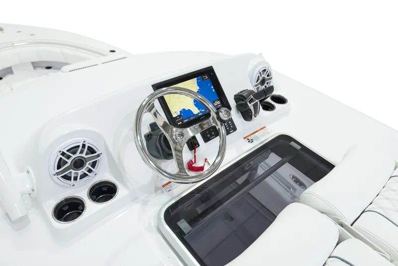 Slide: The Image of 2024 Sportsman 322 OPEN CC INCOMING boat dashboard with navigation system and steering wheel. - 26