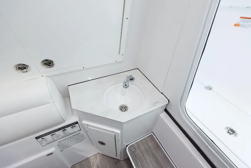 Slide: The Image of 2024 Sportsman 322 OPEN CC boat interior sink and countertop. - 28