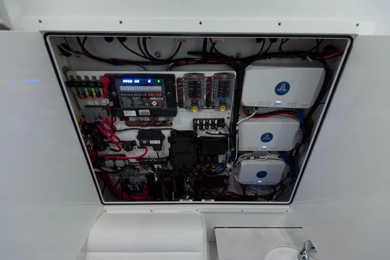 Slide: The Image of Electrical panel of 2024 Sportsman 322 OPEN CC boat with wiring and control systems. - 30