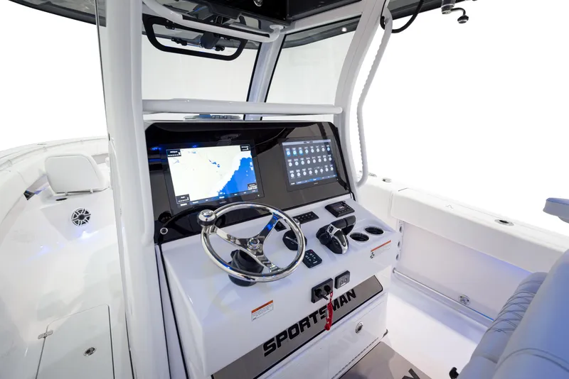 Slide: The Image of 2024 Sportsman 322 OPEN CC INCOMING boat console with advanced navigation and control systems. - 5