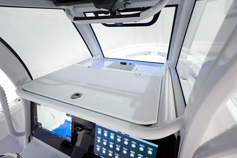 Slide: The Image of 2024 Sportsman 322 OPEN CC INCOMING boat dashboard with advanced navigation system. - 8