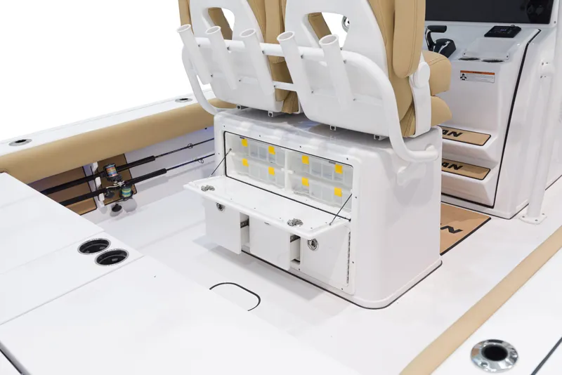 Slide: The Image of 2024 Sportsman Masters 267 Bay Boat interior with seating and storage compartments. - 14