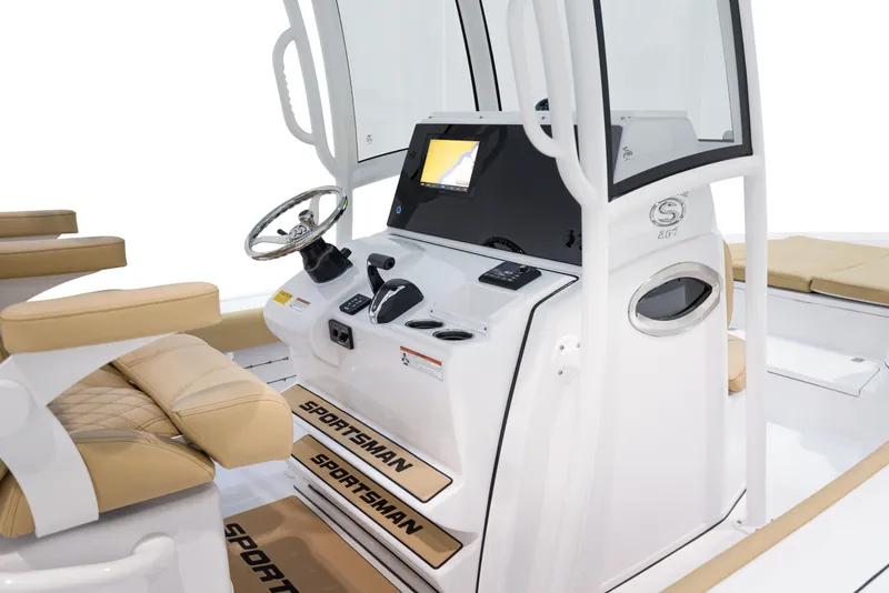 Slide: The Image of 2024 Sportsman Masters 267 Bay Boat interior console and seating area. - 4