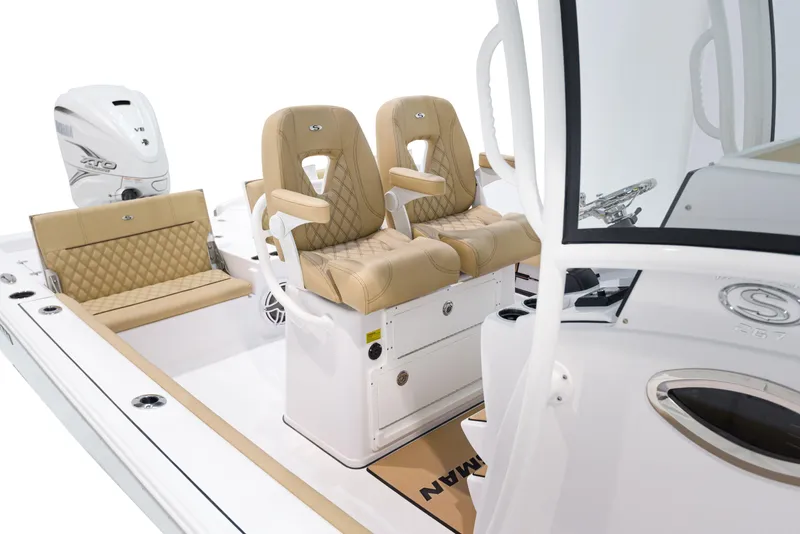 Slide: The Image of 2024 Sportsman Masters 267 Bay Boat interior with tan seating and modern console. - 5