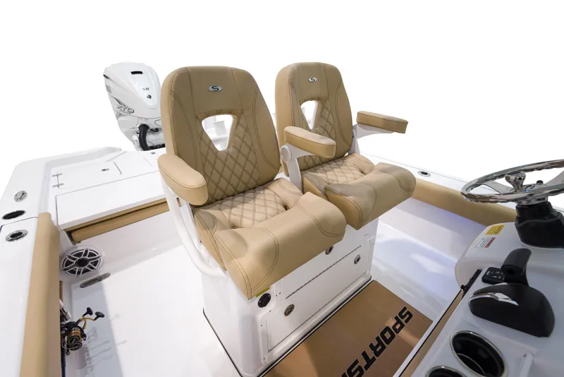 Slide: The Image of 2024 Sportsman Masters 267 Bay Boat with tan leather seats and modern console. - 6