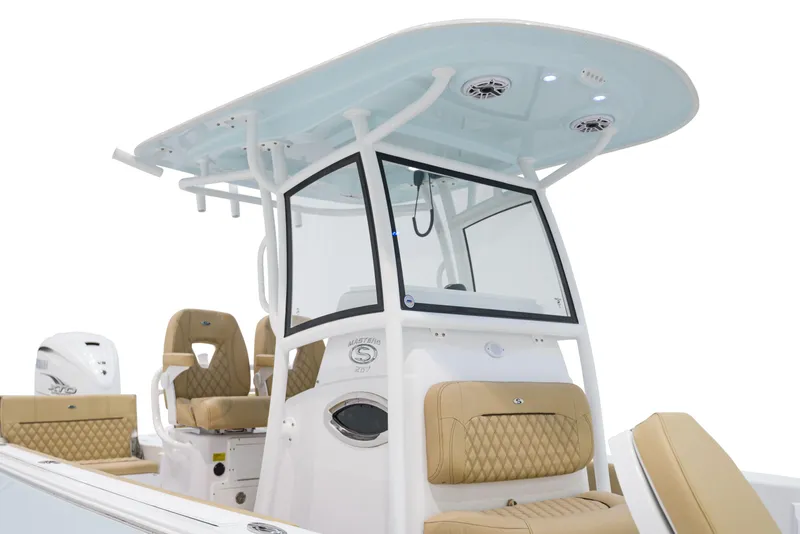 Slide: The Image of 2024 Sportsman Masters 267 Bay Boat with tan seating and a blue T-top. - 7
