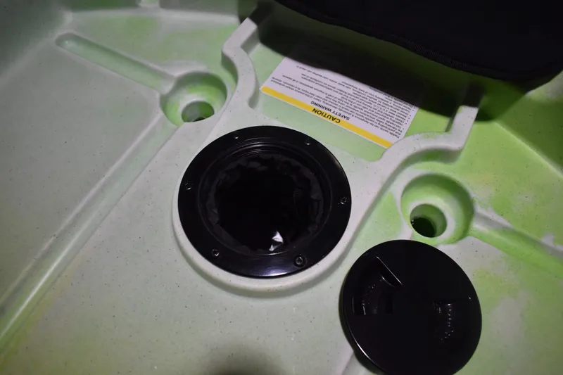 Slide: The Image of 2021 Ascend 9R Sport Sit-On kayak hatch with caution label. - 10