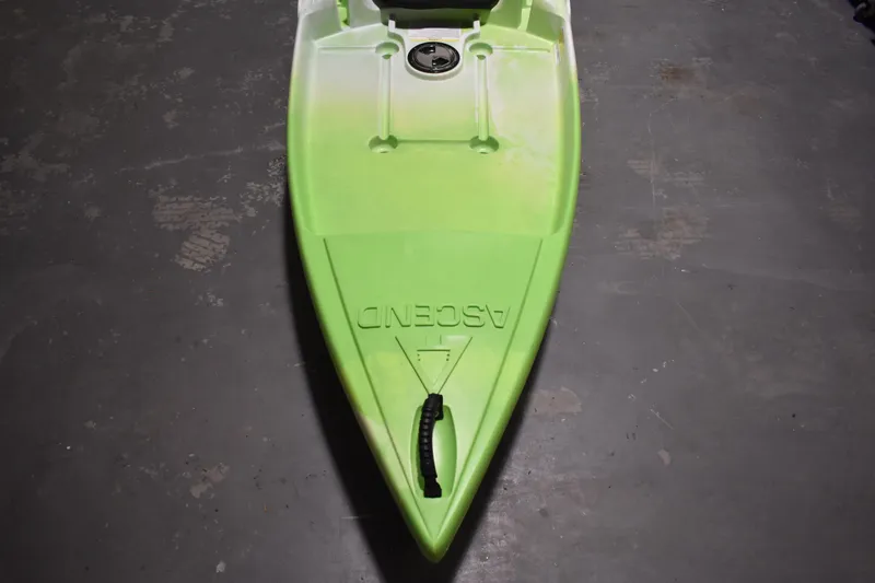 Slide: The Image of Green Ascend 9R Sport Sit-On kayak, 2021 model, on concrete floor. - 7