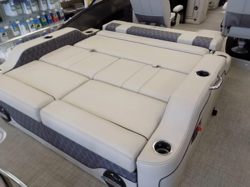 Slide: The Image of 2023 Barletta L23UC boat interior with luxurious seating and cup holders. - 15
