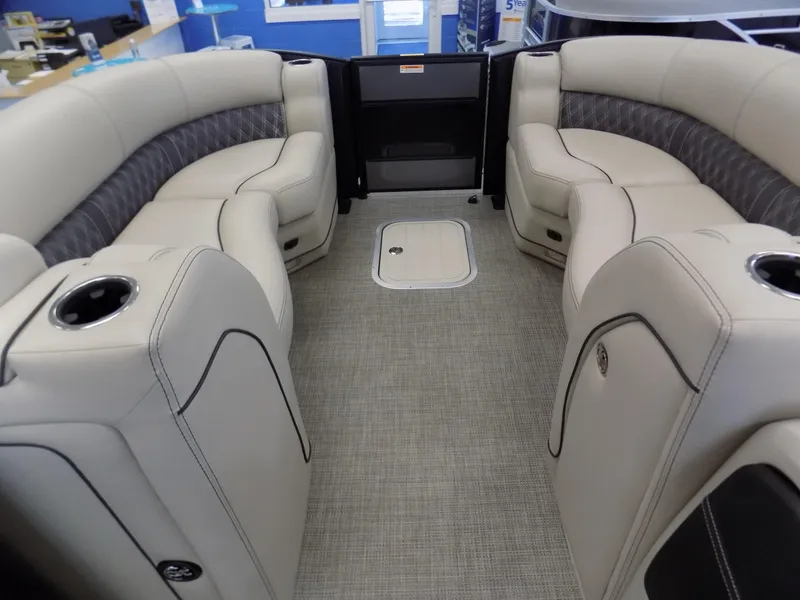 Slide: The Image of 2023 Barletta L23UC pontoon boat interior with luxurious seating and cup holders. - 5