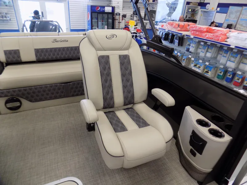Slide: The Image of 2023 Barletta L23UC boat interior with plush seating and modern design. - 9