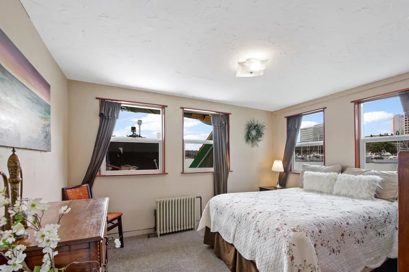Slide: The Image of Cozy bedroom on a 1938 custom ferry with waterfront views, vintage decor, and natural light. - 25