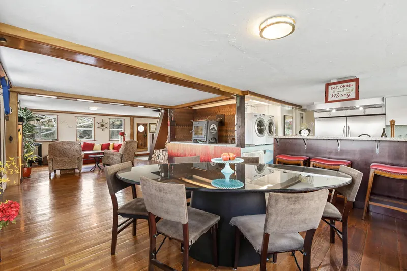 Slide: The Image of Spacious 1938 Ferry Custom interior with dining area, lounge, and kitchen. - 28