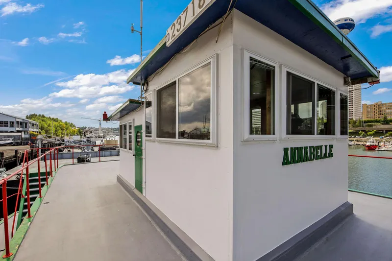 Slide: The Image of 1938 Custom Ferry Annabelle docked at a marina on a sunny day. - 42