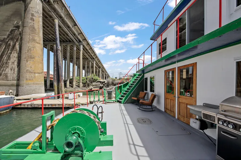Slide: The Image of 1938 Custom Ferry deck with seating, grill, and bridge view. - 49