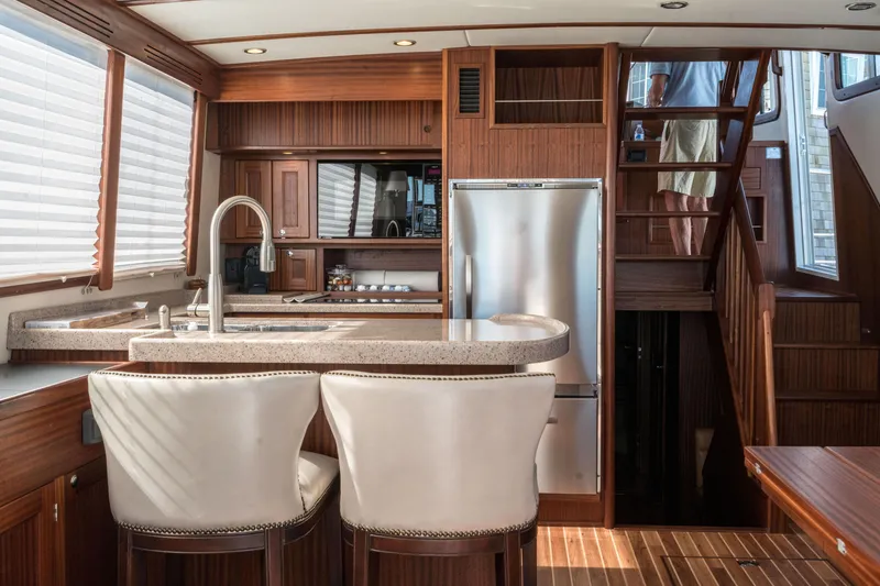 Slide: The Image of Luxurious interior of 2025 Nordic Tug 44 with modern kitchen and seating area. - 3