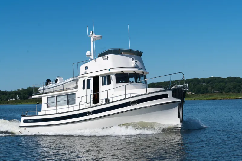 Slide: The Image of 2025 Nordic Tug 44 cruising on a sunny day. - 9