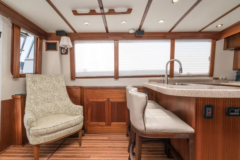 Slide: The Image of Interior of 2025 Nordic Tug 44 with elegant seating and modern kitchen area. - 4