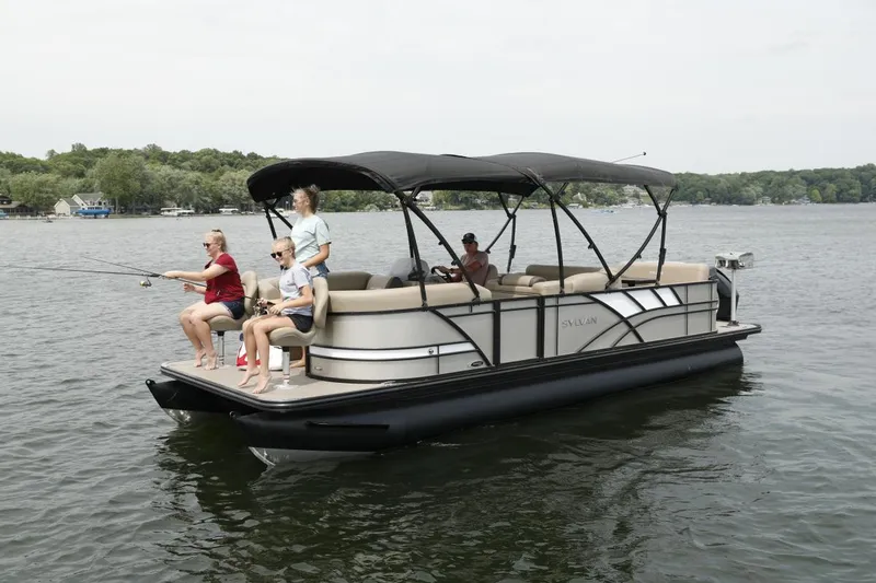 Slide: The Image of 2023 Sylvan 8522 RESORTER pontoon boat with people fishing on a lake. - 2