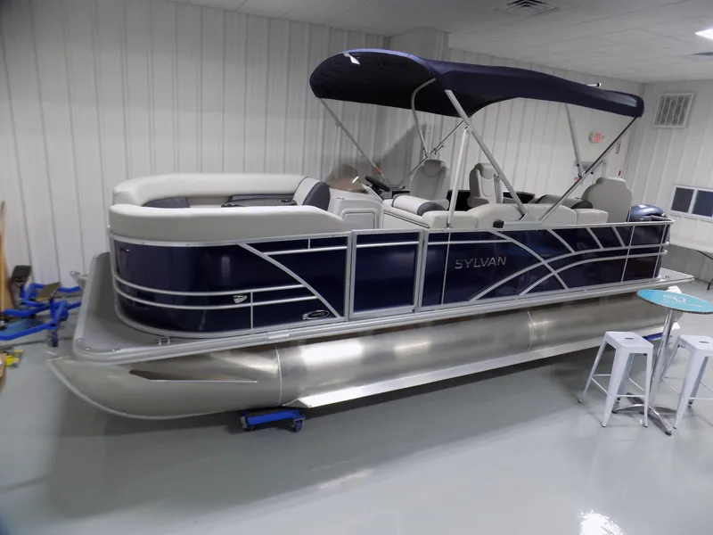 Slide: The Image of 2022 Sylvan Mirage Fish 8522 Party Fish pontoon boat in indoor showroom. - 0