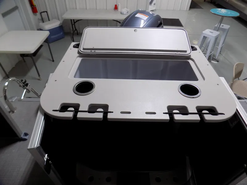 Slide: The Image of 2022 Sylvan Mirage Fish 8522 Party Fish boat interior with storage compartment and cup holders. - 10