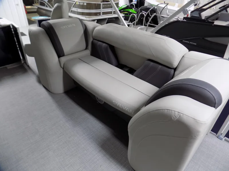 Slide: The Image of 2022 Sylvan Mirage Fish 8522 Party Fish boat interior with plush seating. - 5