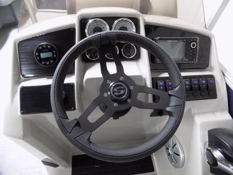 Slide: The Image of 2022 Sylvan Mirage Fish 8522 Party Fish dashboard with steering wheel and controls. - 7