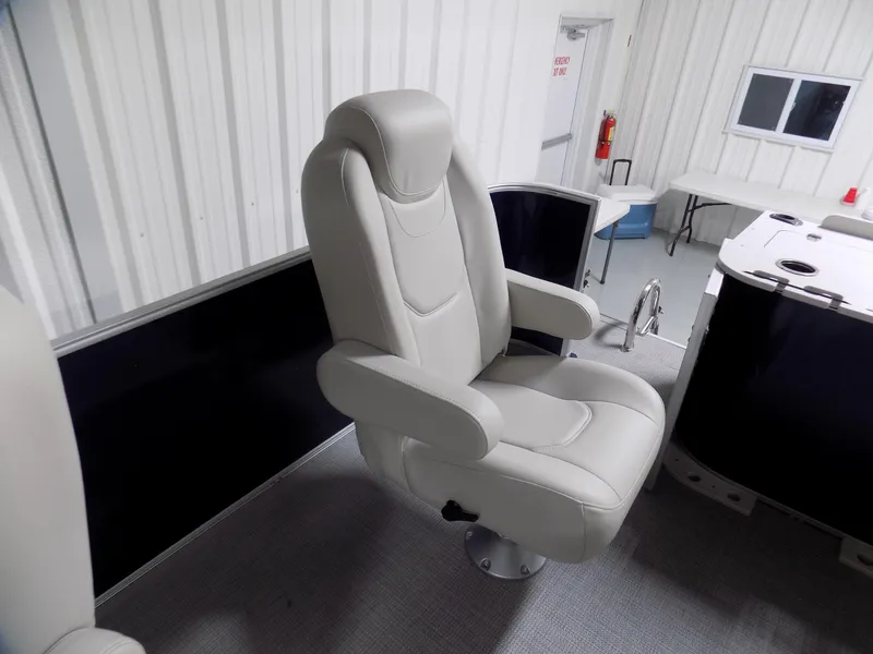 Slide: The Image of Luxurious captain's chair in 2022 Sylvan Mirage Fish 8522 Party Fish boat interior. - 8
