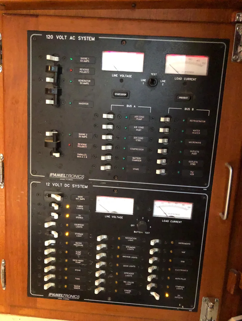 Slide: The Image of Electrical control panel on a 1995 Valiant 50 boat, featuring AC and DC systems. - 23