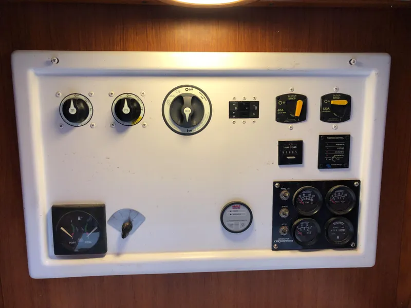 Slide: The Image of Control panel of a 1995 Valiant 50 yacht with various gauges and switches. - 36