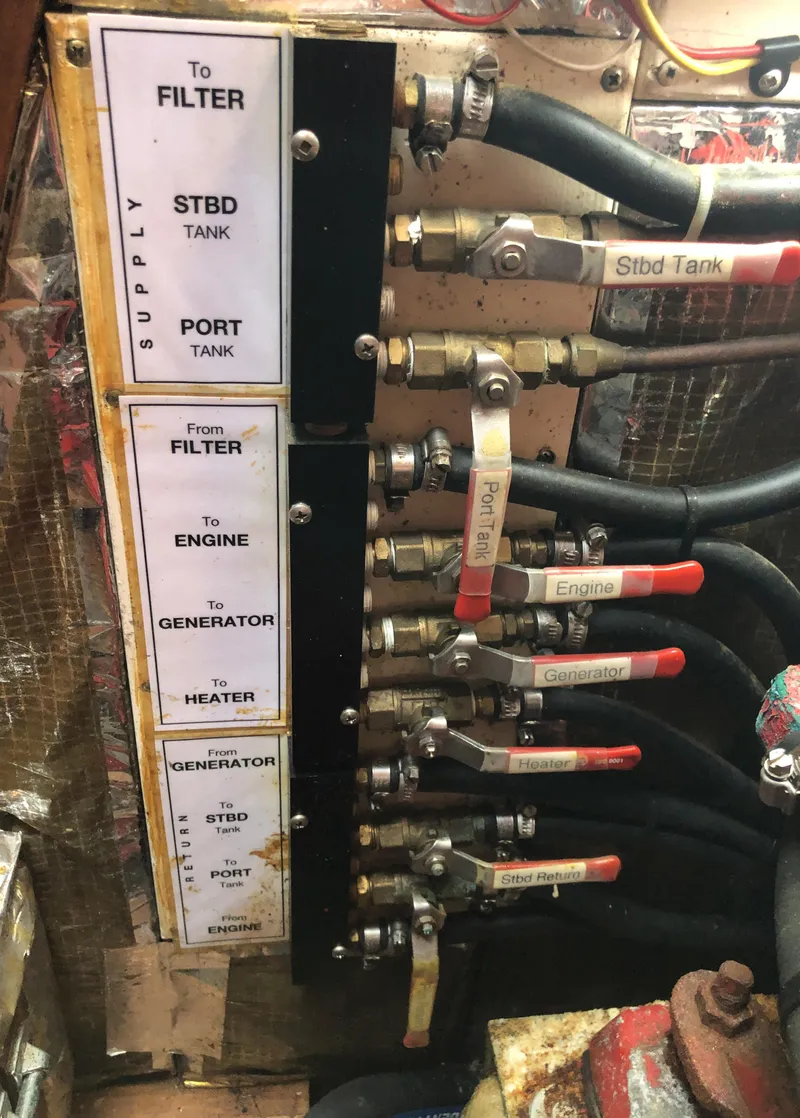 Slide: The Image of Fuel line connections and valves on a 1995 Valiant 50 boat. - 39