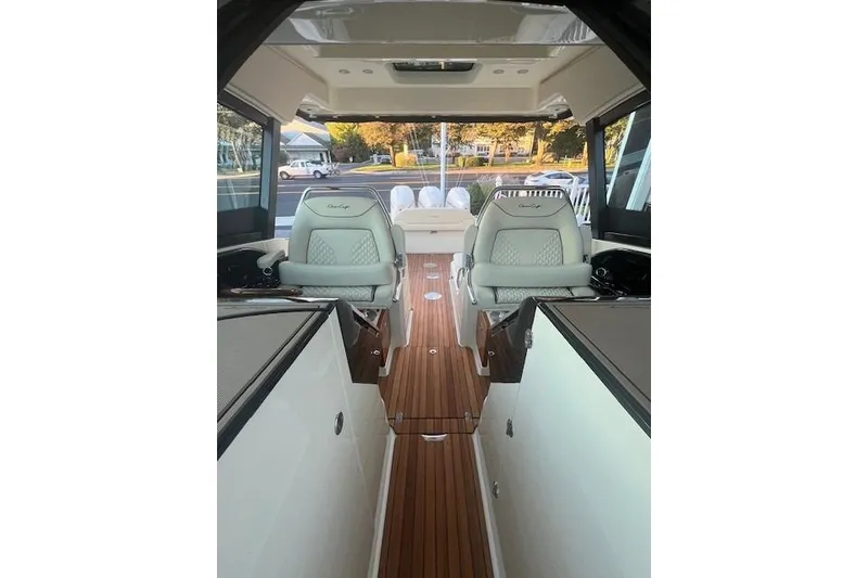 Slide: The Image of Close-up of 2024 Chris-Craft Calypso 35 logo on textured surface. - 12