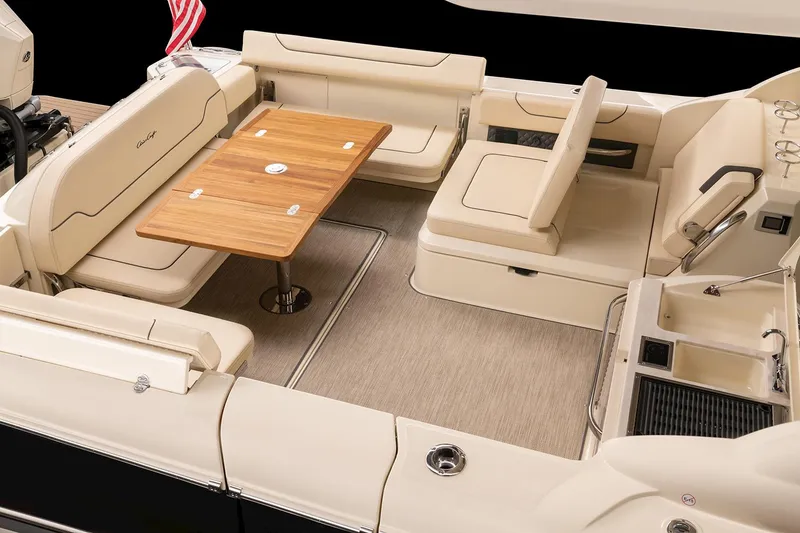 Slide: The Image of 2024 Chris-Craft Calypso 35 boat interior with luxurious seating and wooden flooring. - 5