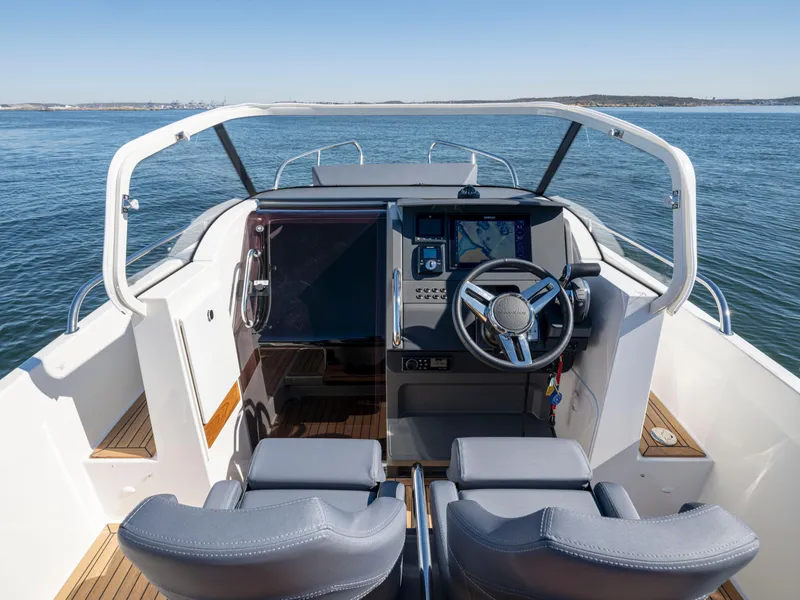 Slide: The Image of Interior view of 2025 Nimbus T8 boat cockpit with modern navigation system. - 7