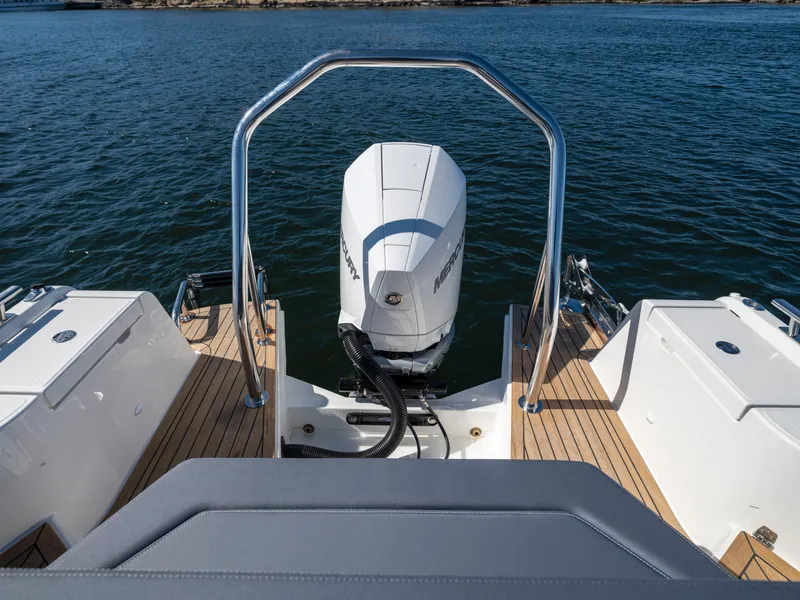 Slide: The Image of Nimbus T8 2025 boat with Mercury outboard motor on a calm lake. - 10