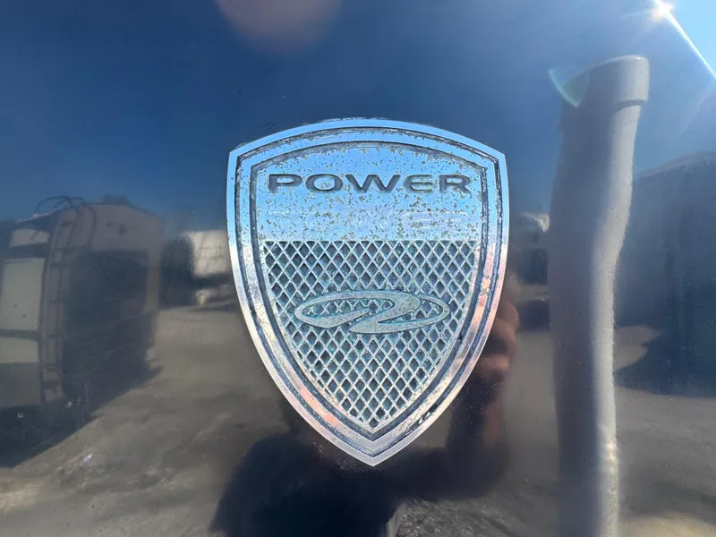 Slide: The Image of Emblem on 2013 Regal 2500 Bowrider boat, featuring "Power" text. - 11