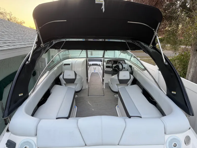 Slide: The Image of 2013 Regal 2500 Bowrider boat interior with seating and canopy. - 19