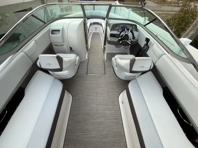 Slide: The Image of 2013 Regal 2500 Bowrider interior with sleek seating and modern dashboard design. - 29