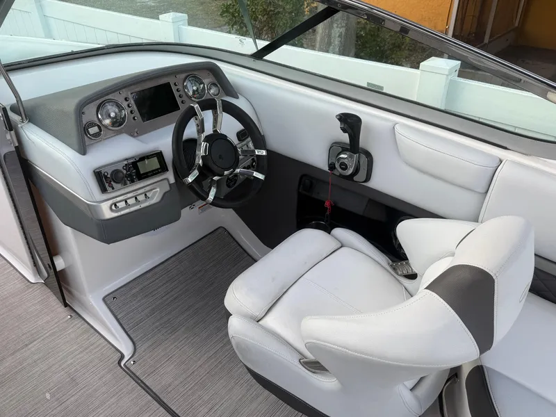 Slide: The Image of 2013 Regal 2500 Bowrider cockpit with modern steering and controls. - 30