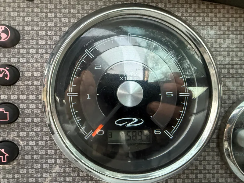 Slide: The Image of Tachometer of 2013 Regal 2500 Bowrider boat displaying RPM and digital readout. - 35