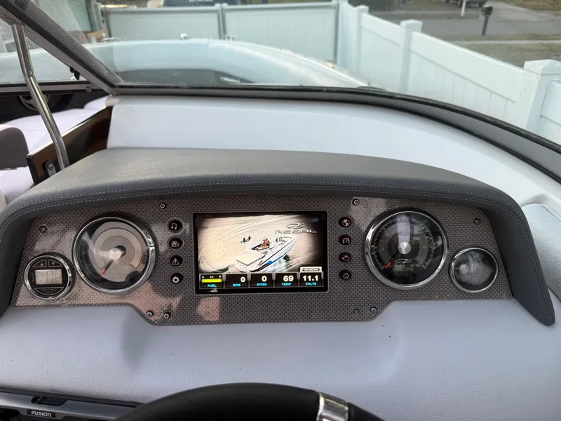 Slide: The Image of Dashboard of 2013 Regal 2500 Bowrider boat with digital display and gauges. - 36